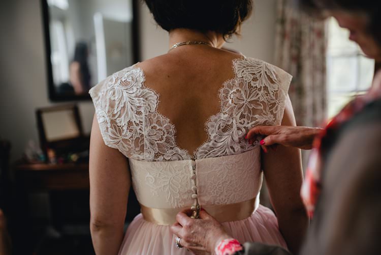 Outdoor Field Forest Wild Nature Floral Arch Marquee Tipi Bride Dress Lace Buttons Mother Prep | Breathtaking Secluded Back Garden Open Sided Tent Wedding Vermont https://kickasscouples.com/