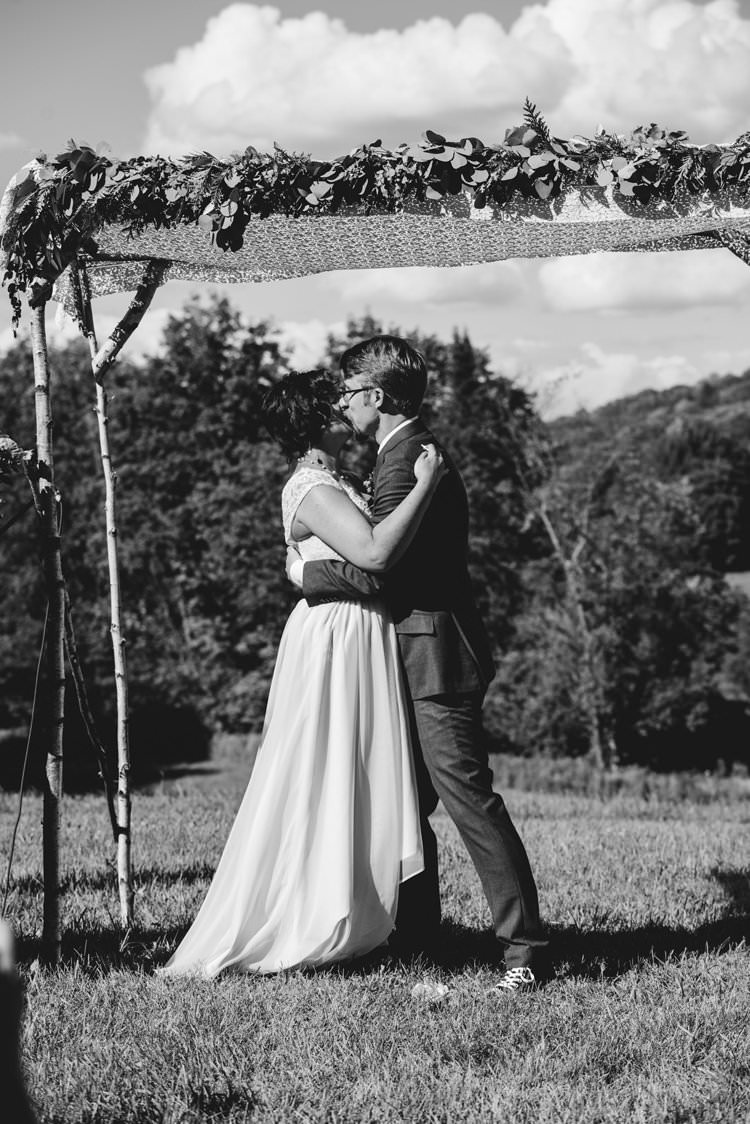 Outdoor Field Forest Wild Nature Marquee Tipi Bride Groom Kiss Floral Arch Ceremony Aisle | Breathtaking Secluded Back Garden Open Sided Tent Wedding Vermont https://kickasscouples.com/