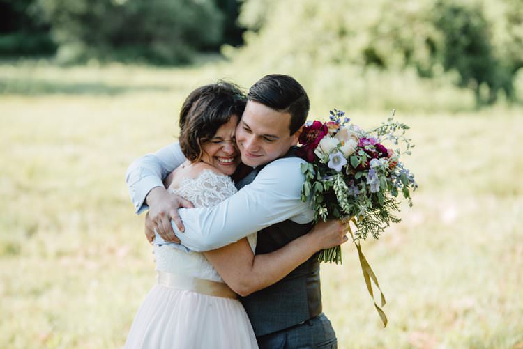 Outdoor Field Forest Wild Nature Marquee Tipi Bride Groom Bouquet Happy Embrace | Breathtaking Secluded Back Garden Open Sided Tent Wedding Vermont https://kickasscouples.com/