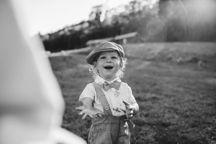 Outdoor Field Forest Wild Nature Marquee Tipi Reception Rustic Pageboy Bowtie Child | Breathtaking Secluded Back Garden Open Sided Tent Wedding Vermont https://kickasscouples.com/