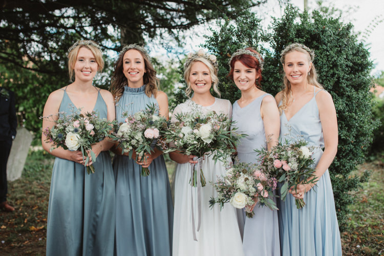 Blue Grey Mismatched Bridesmaid Dresses Bouquets Greenery Foliage Ribbon Flower Crowns Natural Country Garden Hand Crafted Wedding https://emilytylerphotography.com/