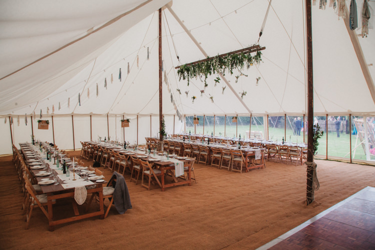 Marquee Rustic Tables Chairs Hanging Flowers Rag Bunting Natural Country Garden Hand Crafted Wedding https://emilytylerphotography.com/