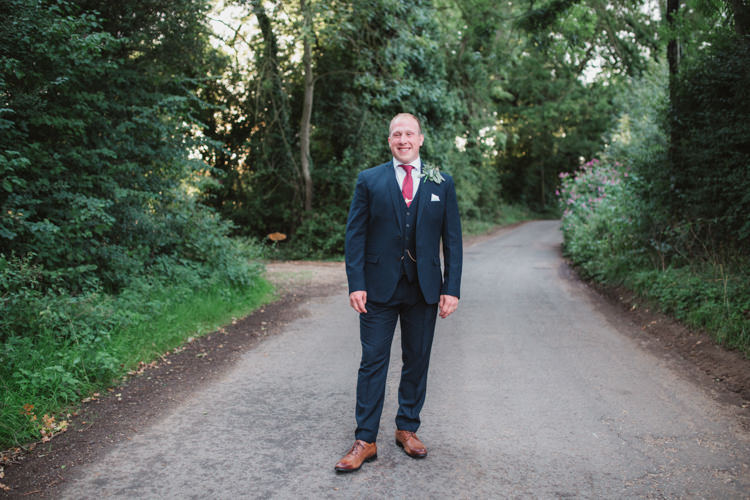 Navy Suit Red Tie Groom Natural Country Garden Hand Crafted Wedding https://emilytylerphotography.com/