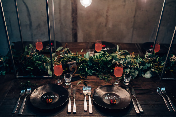 Table Tablescape Flowers Black Plates Calligraphy Swag Garland Edgy Raw Industrial Barn Wedding Ideas Greenery Festoon Lights http://www.two-d.co.uk/