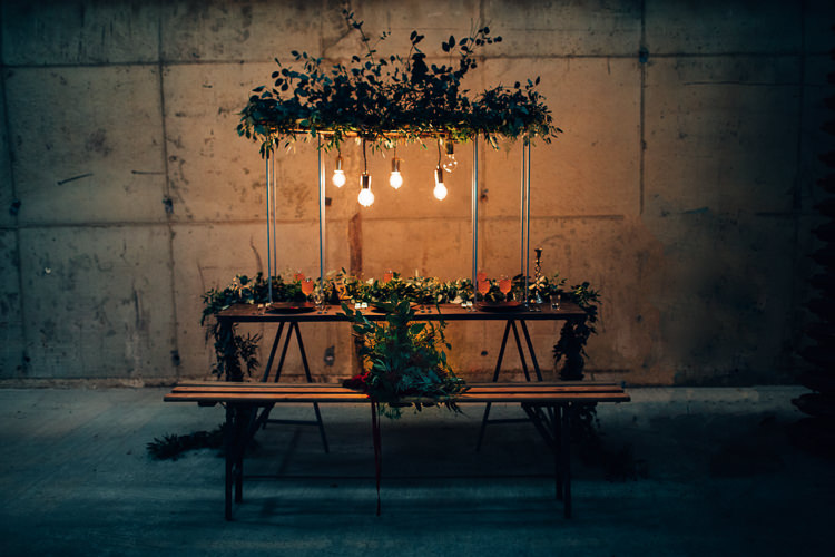 Table Tablescape Flowers Black Plates Calligraphy Swag Garland Suspended Edgy Raw Industrial Barn Wedding Ideas Greenery Festoon Lights http://www.two-d.co.uk/