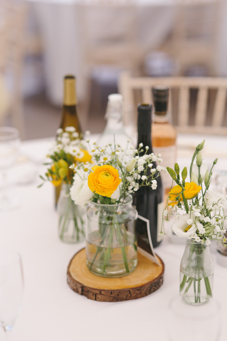Jar Flowers Log Slice Gypsophila Ranunculus Pretty Spring Yellow Fun Personal Wedding Yeldersley Hall Derbyshire http://www.elliegracephotography.co.uk/
