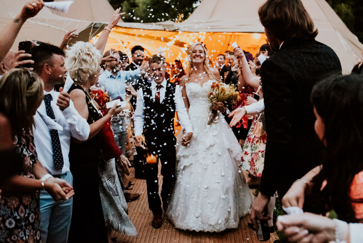 Bride Bridal Sweetheart Neckline Lace A Line Shoulder Jewellery Pearls Floral Flower Hairband Meadow Wildflower Corn Bouquet Groom Waistcoat Red Tie Confetti Shot Practically Perfect Tipi Camp Wedding Thwaite Mills https://photo.shuttergoclick.com/index
