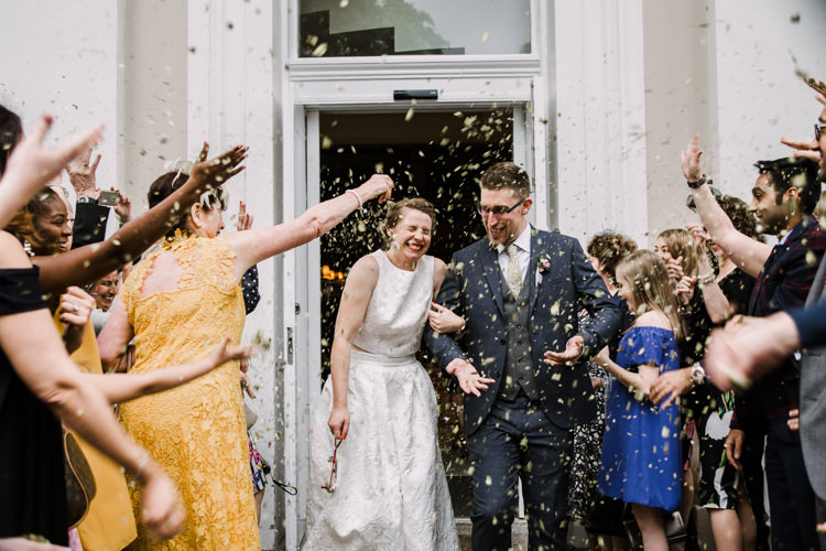 Bride Bridal Dress Gown Two Piece Crop Top Groom Grey Blue Green Three Piece Waistcoat Confetti Shot Fun DIY Wedding New Walk Museum Leicester https://www.daniellefrancescaphotography.com/