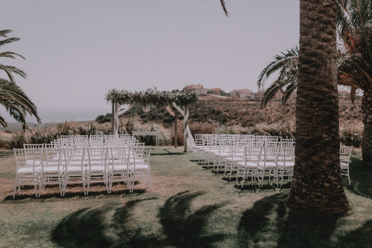 Outdoor Fields Garden Villa Italy Rustic Natural Vineyard Orchard Ceremony Aisle Palm Floral Arch | Sage Green Mediterranean Destination Wedding Spain https://www.kinoortega.com/