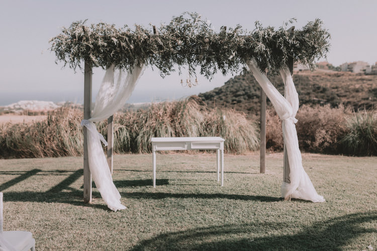 Outdoor Fields Garden Villa Italy Rustic Natural Vineyard Orchard White Floral Arch Ceremony Aisle | Sage Green Mediterranean Destination Wedding Spain https://www.kinoortega.com/