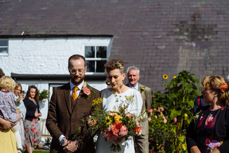 DIY Ceremony Aisle Bride Groom Yellow Wildflower Bouquet Seasonal Alternative Hippy Farm Field Garden Wedding | Homegrown Community Eclectic Rural Yorkshire Wedding https://toastofleeds.co.uk/