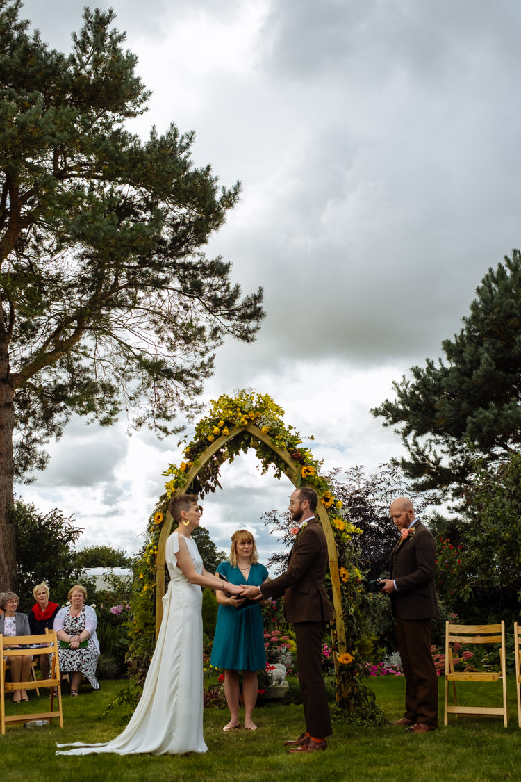 DIY Ceremony Bride Groom Yellow Wildflower Floral Arch Seasonal Alternative Hippy Farm Field Garden Wedding | Homegrown Community Eclectic Rural Yorkshire Wedding https://toastofleeds.co.uk/