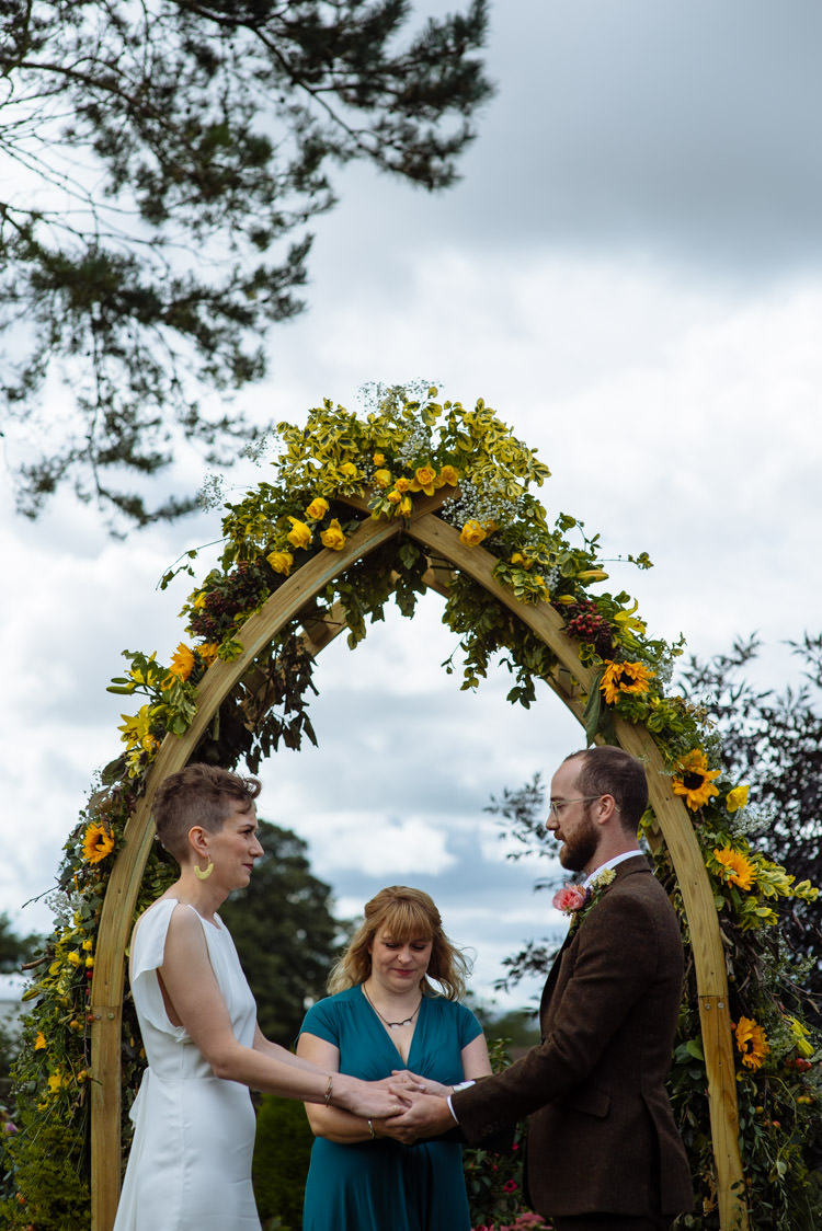 DIY Ceremony Bride Groom Yellow Wildflower Floral Arch Seasonal Alternative Hippy Farm Field Garden Wedding | Homegrown Community Eclectic Rural Yorkshire Wedding https://toastofleeds.co.uk/