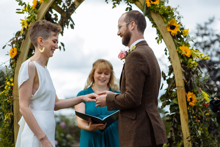 DIY Ceremony Bride Groom Ring Yellow Wildflower Floral Arch Seasonal Alternative Hippy Farm Field Garden Wedding | Homegrown Community Eclectic Rural Yorkshire Wedding https://toastofleeds.co.uk/