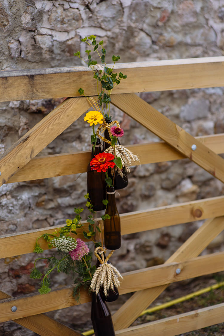 DIY Marquee Tipi Beer Bottle Decor Alternative Hippy Forest Farm Field Garden Wedding | Homegrown Community Eclectic Rural Yorkshire Wedding https://toastofleeds.co.uk/