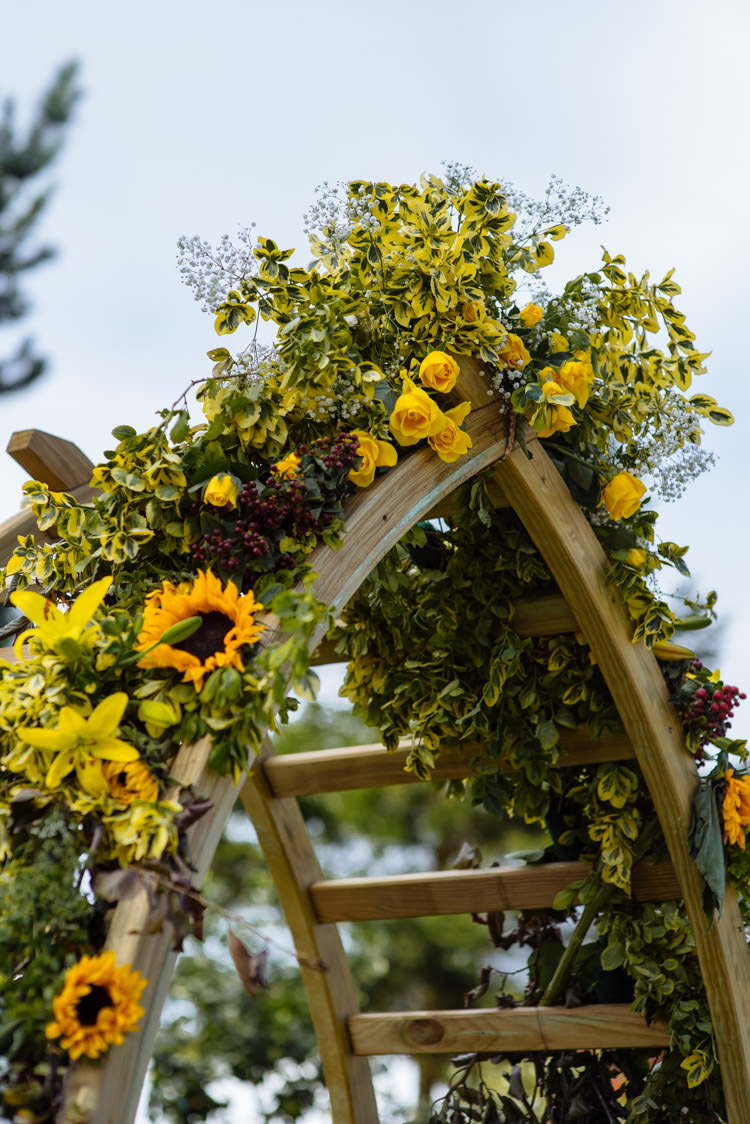 DIY Ceremony Arch Floral Yellow Sunflower Seasonal Alternative Hippy Farm Field Garden Wedding | Homegrown Community Eclectic Rural Yorkshire Wedding https://toastofleeds.co.uk/