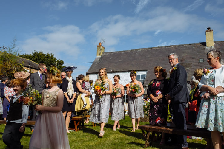 DIY Ceremony Aisle Bridesmaids Yellow Bouquets Seasonal Alternative Hippy Farm Field Garden Wedding | Homegrown Community Eclectic Rural Yorkshire Wedding https://toastofleeds.co.uk/