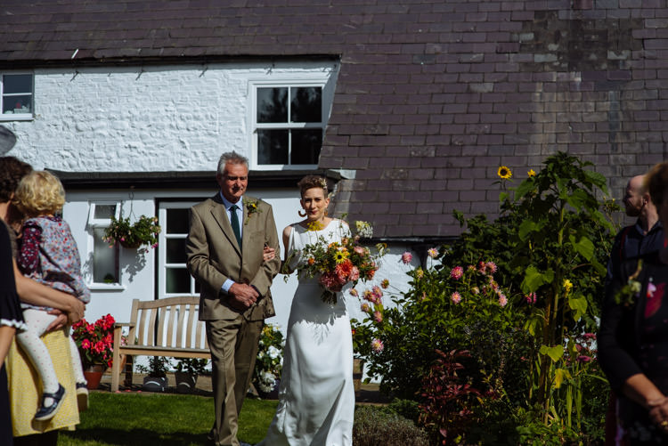 DIY Ceremony Aisle Bride Father Yellow Wildflower Bouquet Seasonal Alternative Hippy Farm Field Garden Wedding | Homegrown Community Eclectic Rural Yorkshire Wedding https://toastofleeds.co.uk/