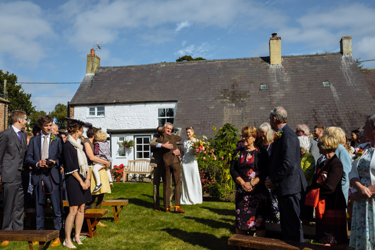 DIY Ceremony Aisle Bride Father Yellow Wildflower Bouquet Seasonal Alternative Hippy Farm Field Garden Wedding | Homegrown Community Eclectic Rural Yorkshire Wedding https://toastofleeds.co.uk/