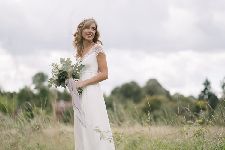 Bride Bridal Rembo Styling Lace V Neck Dress Gown Hairpiece White Cream Rose Bouquet Eucalyptus Greenery Relaxed Bohemian Summer Meadow Wedding https://karibellamy.com/
