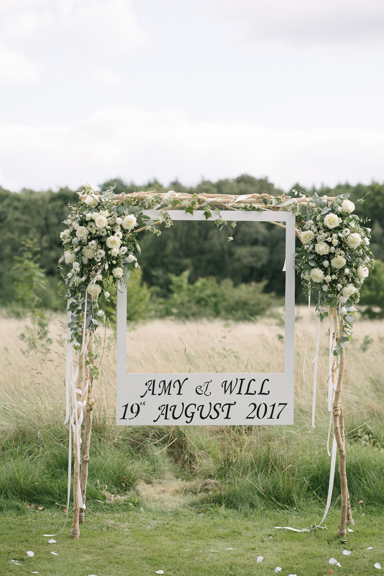 Arch Arbour Photobooth Backdrop Polaroid White Cream Rose Flower Floral Wooden Relaxed Bohemian Summer Meadow Wedding https://karibellamy.com/