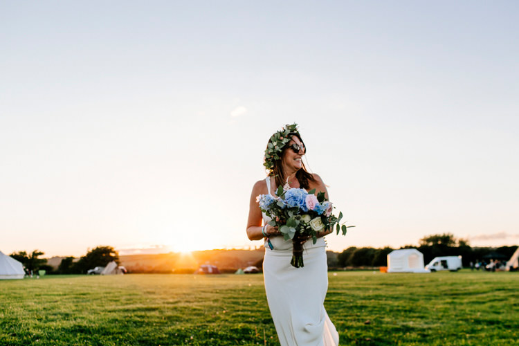 Bride Bridal Dress Gown Flowers Bouquet Crown Sunglasses Bright Fun Festival Boho Wedding The Party Field East Sussex http://epiclovestory.co.uk/