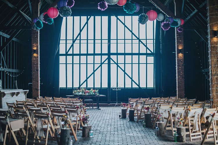 Barn Ceremony Paper Lantern Pom Pom Chair Decoration Wood Slice Log Jar Flowers Colourful Informal Wedding Victorian Fairground Games Elmley Nature Reserve Kent http://www.juliaandyou.com/