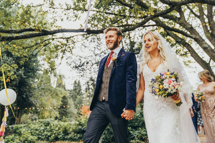 Groom Navy Suit Tweed Waistcoat Red Tie Colourful Outdoor Tipi Wedding Tekels Park Surrey https://grahamnixon.com/