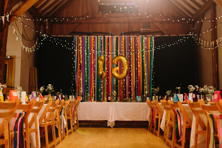 Barn Festoon Lights Bunting Backdrop Ribbon Balloons Alternative Rainbow Fun Loving Budget Wedding Hanger Farm Arts Centre Southampton https://www.nicolastreaderphotography.co.uk/