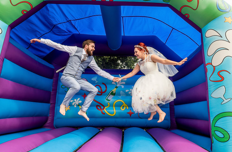 Bouncy Castle Mismatched Colourful Wildflower Meadow Wedding Hush Venues Norfolk http://lighteningphotography.co.uk/