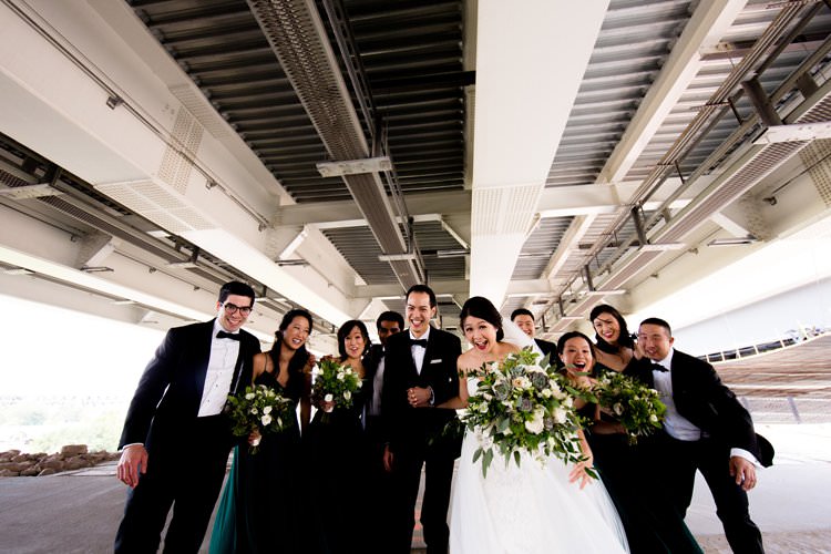 Bride Groom Bridesmaids Groomsmen Group Photo Bridge Hangar | Black Tie Carnival Wedding Hot Air Balloon http://www.makingthemoment.com/