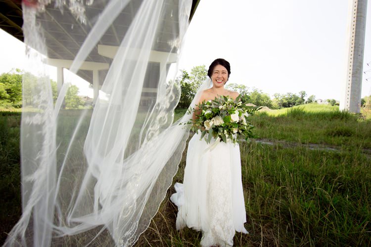 Bride Veil Shot Camera Photo Greenery White Bouquet | Black Tie Carnival Wedding Hot Air Balloon http://www.makingthemoment.com/
