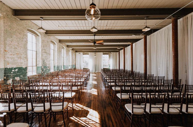 City Urban Georgia Engine Room Exposed Bricks Ceremony Aisle Brown Chiavari Chairs | Bohemian Industrial Oxblood Wedding https://www.lunaleephotos.com/