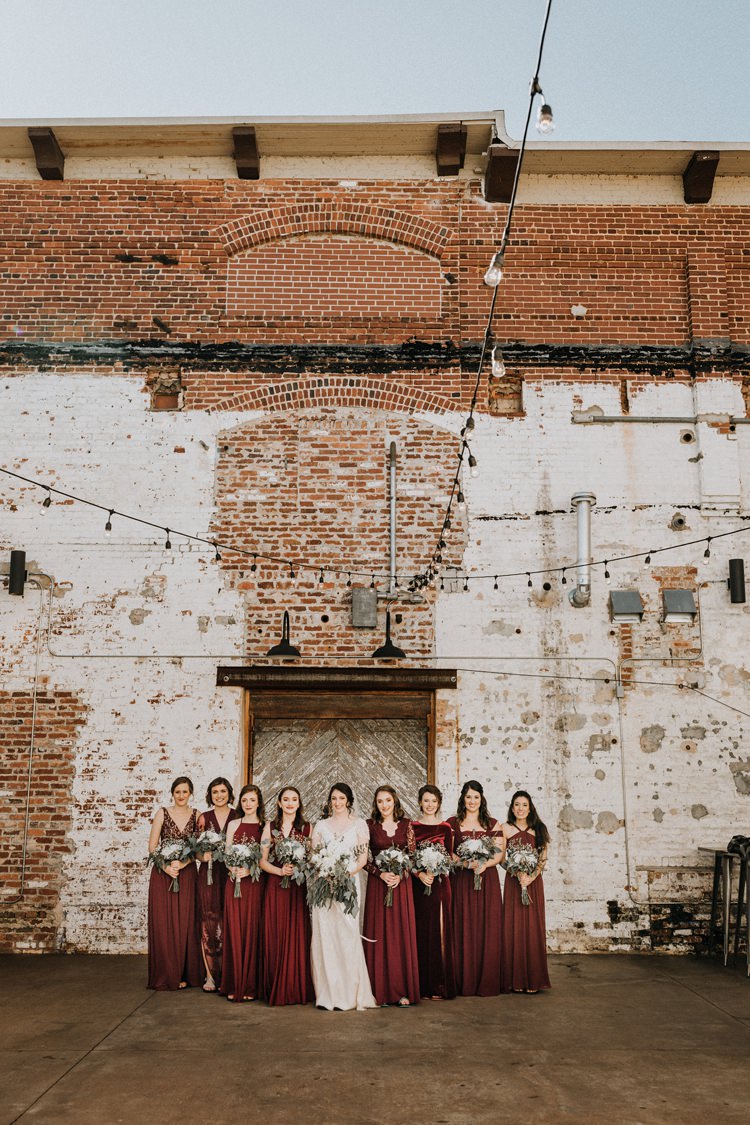 City Urban Georgia Engine Room Exposed Bricks Bride Burgundy Bridesmaids White Foliage Bouquet | Bohemian Industrial Oxblood Wedding https://www.lunaleephotos.com/