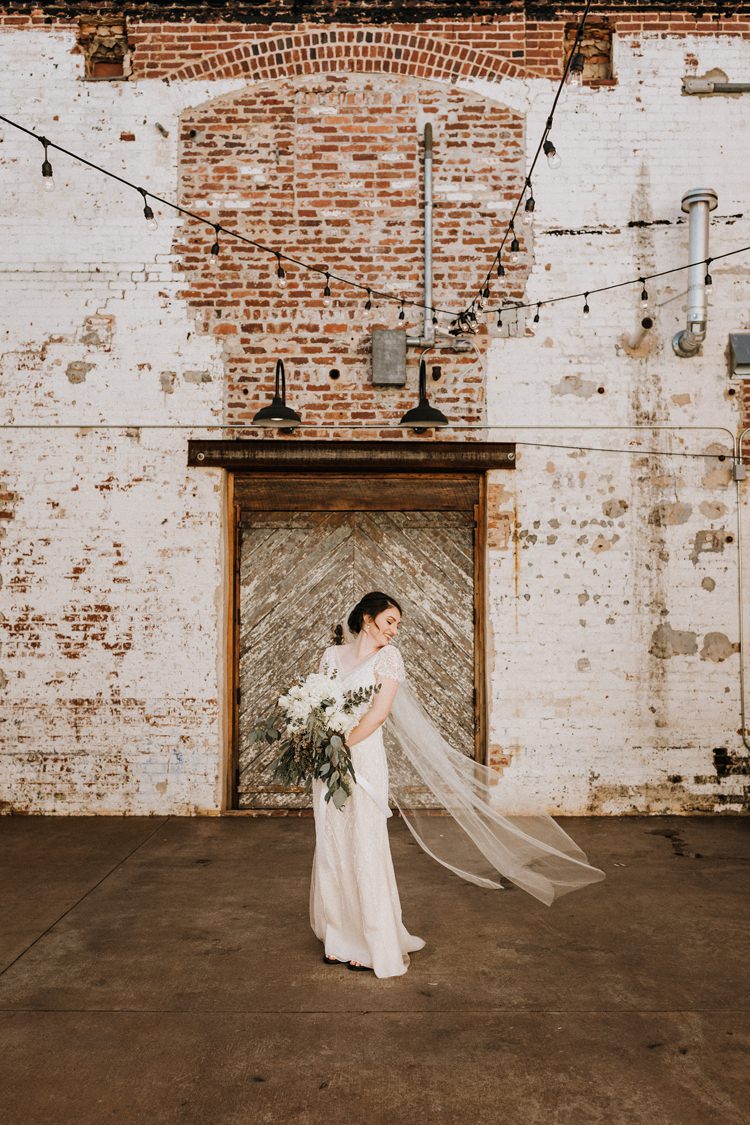 City Urban Georgia Engine Room Exposed Bricks Bride White Foliage Bouquet Veil | Bohemian Industrial Oxblood Wedding https://www.lunaleephotos.com/