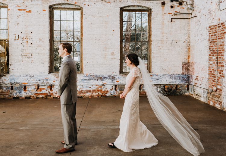 City Urban Georgia Engine Room Exposed Bricks Bride Groom Embrace First Look | Bohemian Industrial Oxblood Wedding https://www.lunaleephotos.com/