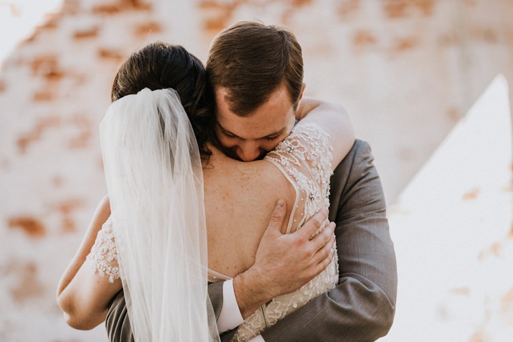 City Urban Georgia Engine Room Exposed Bricks Bride Groom Embrace First Look | Bohemian Industrial Oxblood Wedding https://www.lunaleephotos.com/