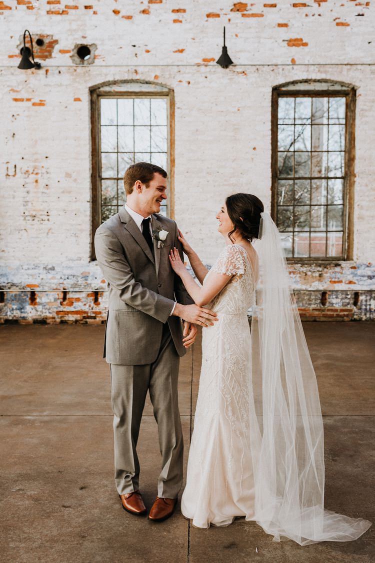 City Urban Georgia Engine Room Exposed Bricks Bride Groom Embrace First Look | Bohemian Industrial Oxblood Wedding https://www.lunaleephotos.com/