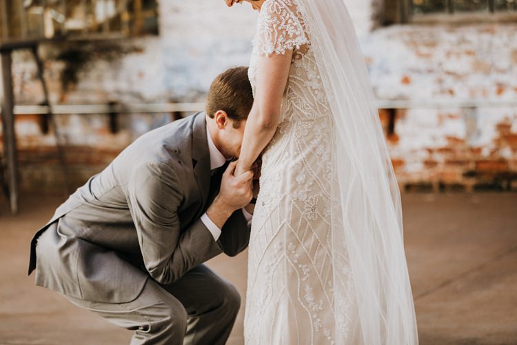 City Urban Georgia Engine Room Exposed Bricks Bride Groom Embrace First Look | Bohemian Industrial Oxblood Wedding https://www.lunaleephotos.com/