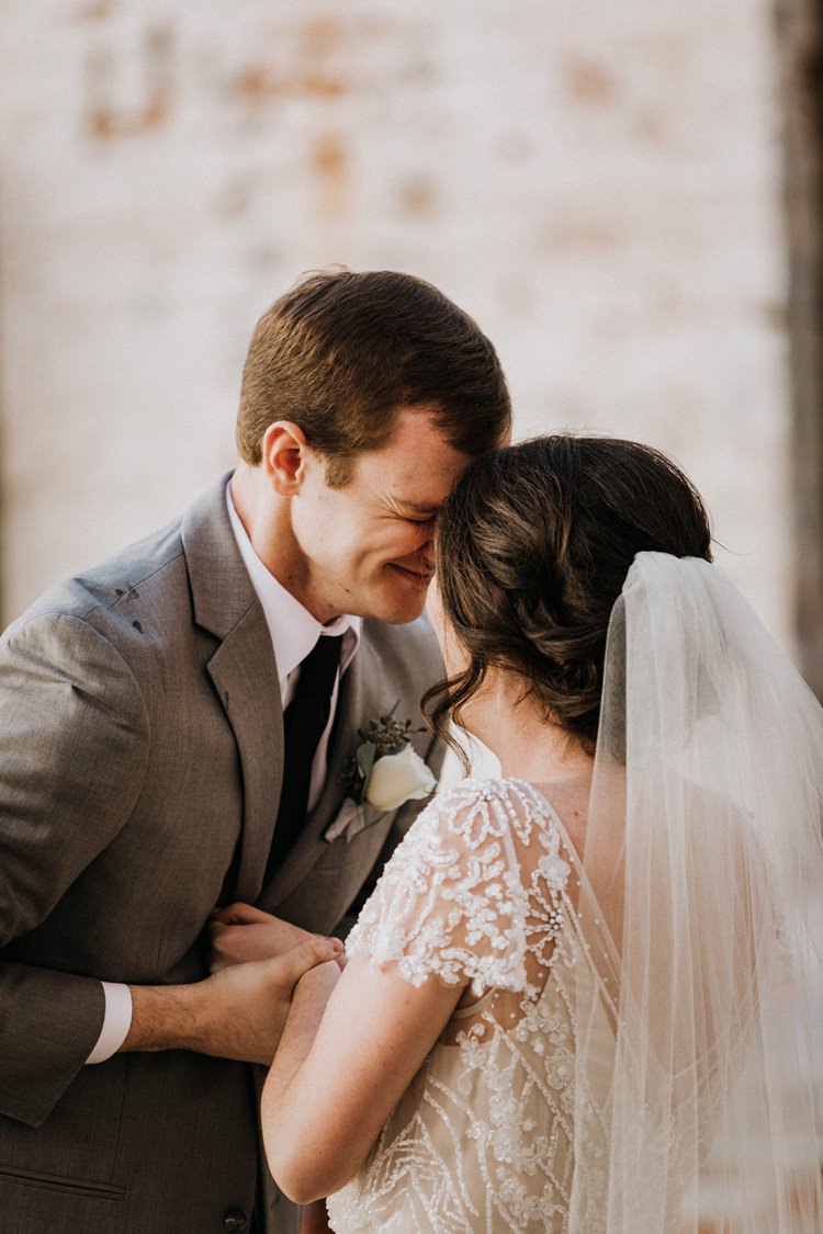 City Urban Georgia Engine Room Exposed Bricks Bride Groom Embrace First Look | Bohemian Industrial Oxblood Wedding https://www.lunaleephotos.com/