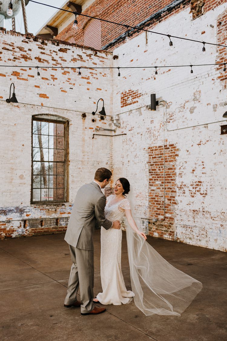 City Urban Georgia Engine Room Exposed Bricks Bride Groom Embrace First Look | Bohemian Industrial Oxblood Wedding https://www.lunaleephotos.com/
