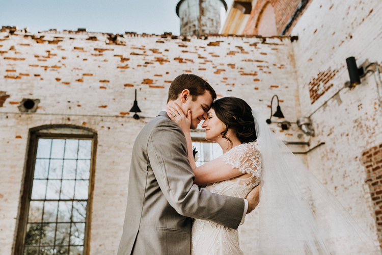 City Urban Georgia Engine Room Exposed Bricks Bride Groom Embrace First Look | Bohemian Industrial Oxblood Wedding https://www.lunaleephotos.com/