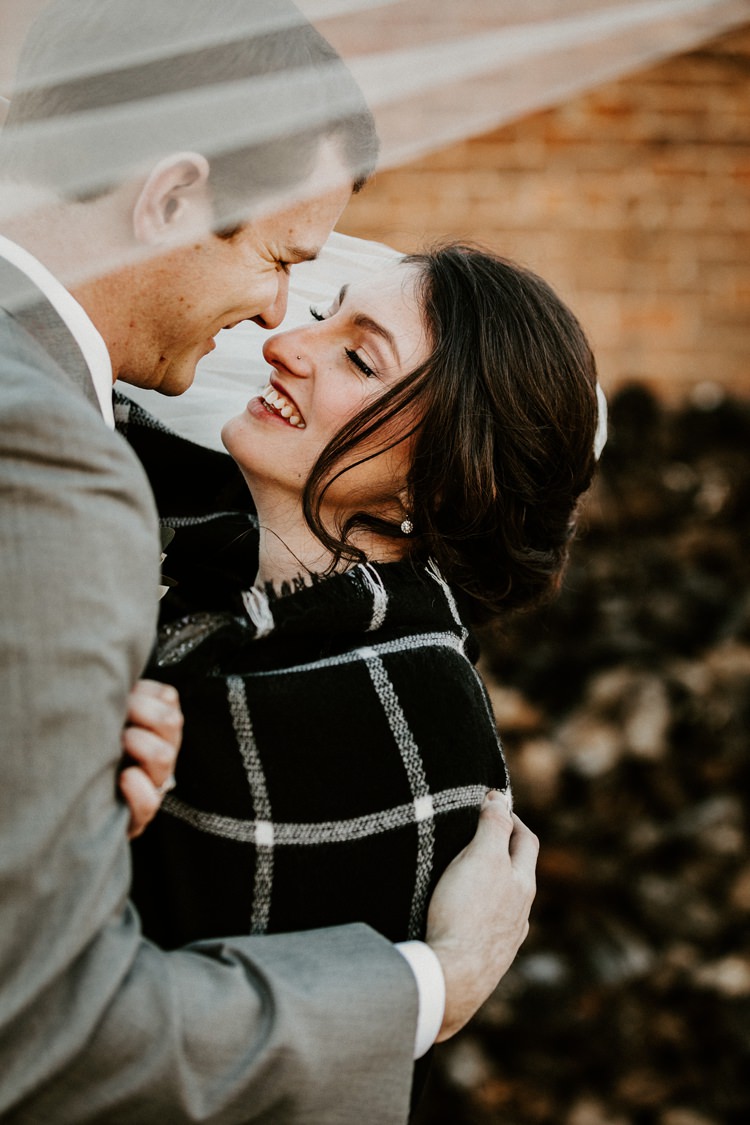 City Urban Georgia Engine Room Exposed Bricks Bride Groom Embrace First Look Blanket | Bohemian Industrial Oxblood Wedding https://www.lunaleephotos.com/