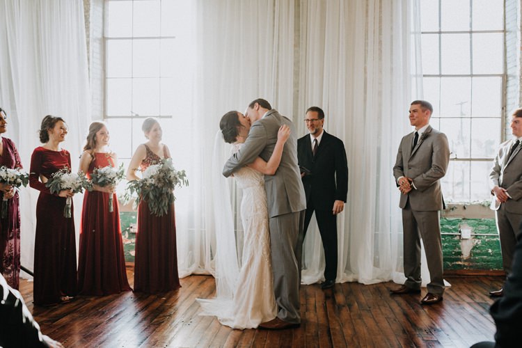 City Urban Georgia Engine Room Exposed Bricks Ceremony Aisle Bride Groom Greenery White Bouquet | Bohemian Industrial Oxblood Wedding https://www.lunaleephotos.com/