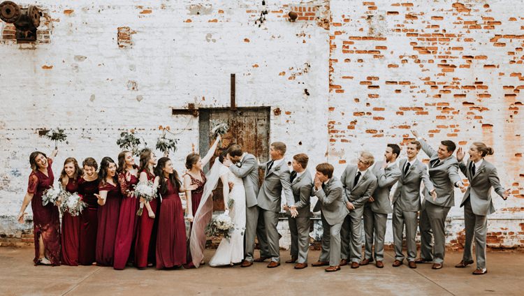 City Urban Georgia Engine Room Exposed Bricks Bridesmaids Groomsmen Bride Groom Kiss | Bohemian Industrial Oxblood Wedding https://www.lunaleephotos.com/