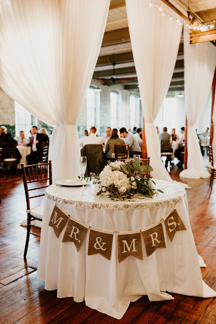 City Urban Georgia Engine Room Exposed Bricks Reception Dinner Chiavari Chairs Rustic Hessian Bunting | Bohemian Industrial Oxblood Wedding https://www.lunaleephotos.com/