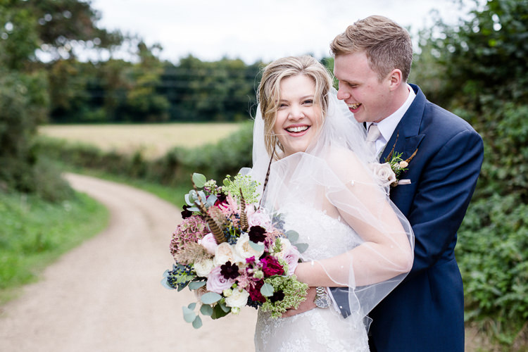 Bride Bridal Lace Strapless Dress Tulle Veil Bouquet Multicoloured Pheasant Feather Groom Blue Tails Waistcoat Three Piece Suit Autumn Countryside Family Farm Wedding Dorset http://www.lydiastampsphotography.com/