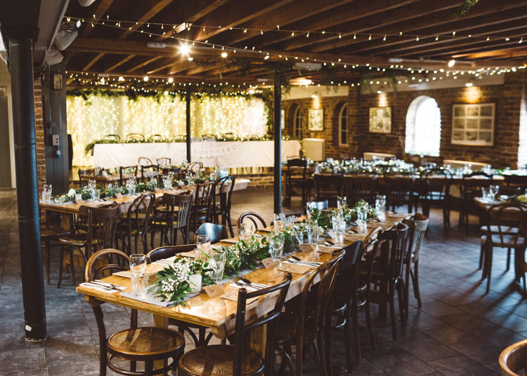 Fairylights Greenery Runner Wooden Tables Pea Light Curtain Foliage Cool Stylish Windy Coastal Wedding East Quay Lobster Shack Whitstable http://holliecarlinphotography.com/