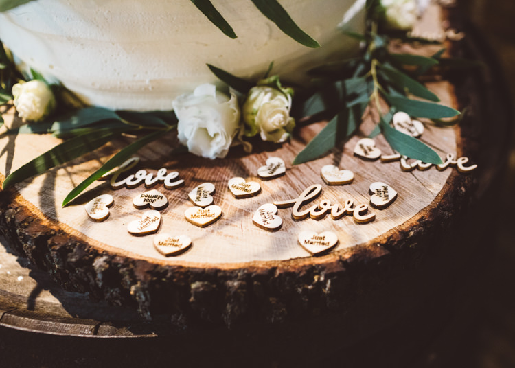 Wood Slice Wooden Hearts Laser Cut Cake White Cream Roses Greenery Foliage Cool Stylish Windy Coastal Wedding East Quay Lobster Shack Whitstable http://holliecarlinphotography.com/
