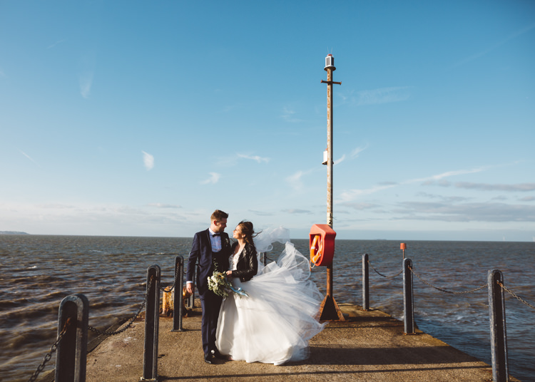 Bride Bridal Hayley Paige Dress Gown Tulle Princess Tuxedo Groom Waistcoat Navy Bow Tie Bouquet Ribbon Leather Jacket Cool Stylish Windy Coastal Wedding East Quay Lobster Shack Whitstable http://holliecarlinphotography.com/